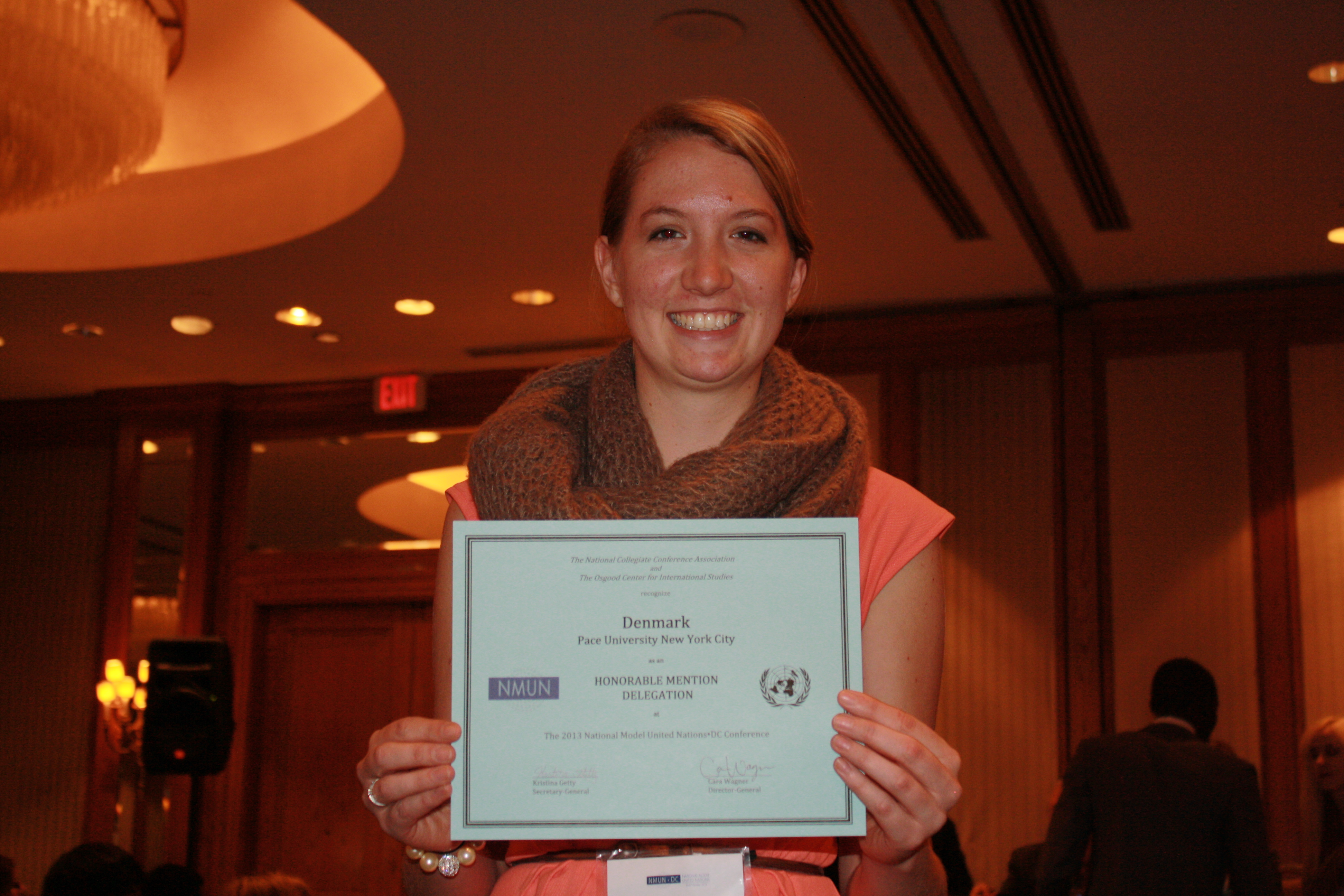 Head delegate Kelsey McGhee, head delegate of the Pace University New York City Model UN program, shows off an awarded granted to the students representing ?? at the 2013 National Model UN conference in Washington DC