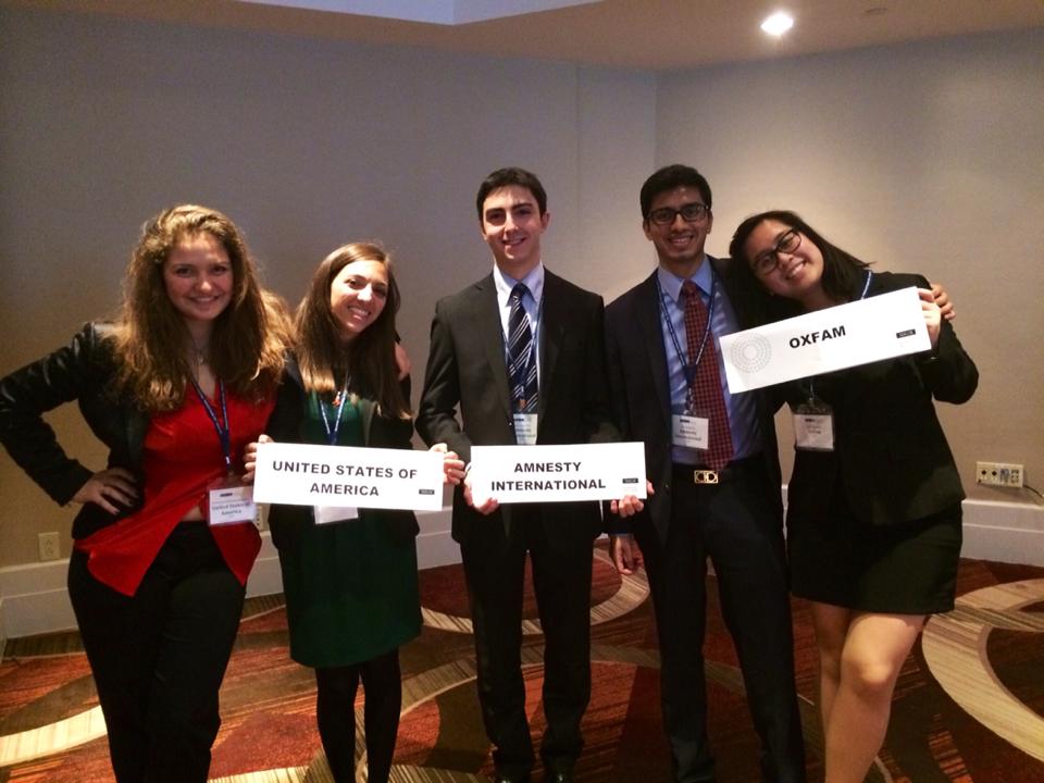Two friends, Vato Gogsadze, Harsh Mehta and Nelli Agbulos participating in a simulation of the Commission on the Status of Women at the 2014 National Model United Nations conference in New York.