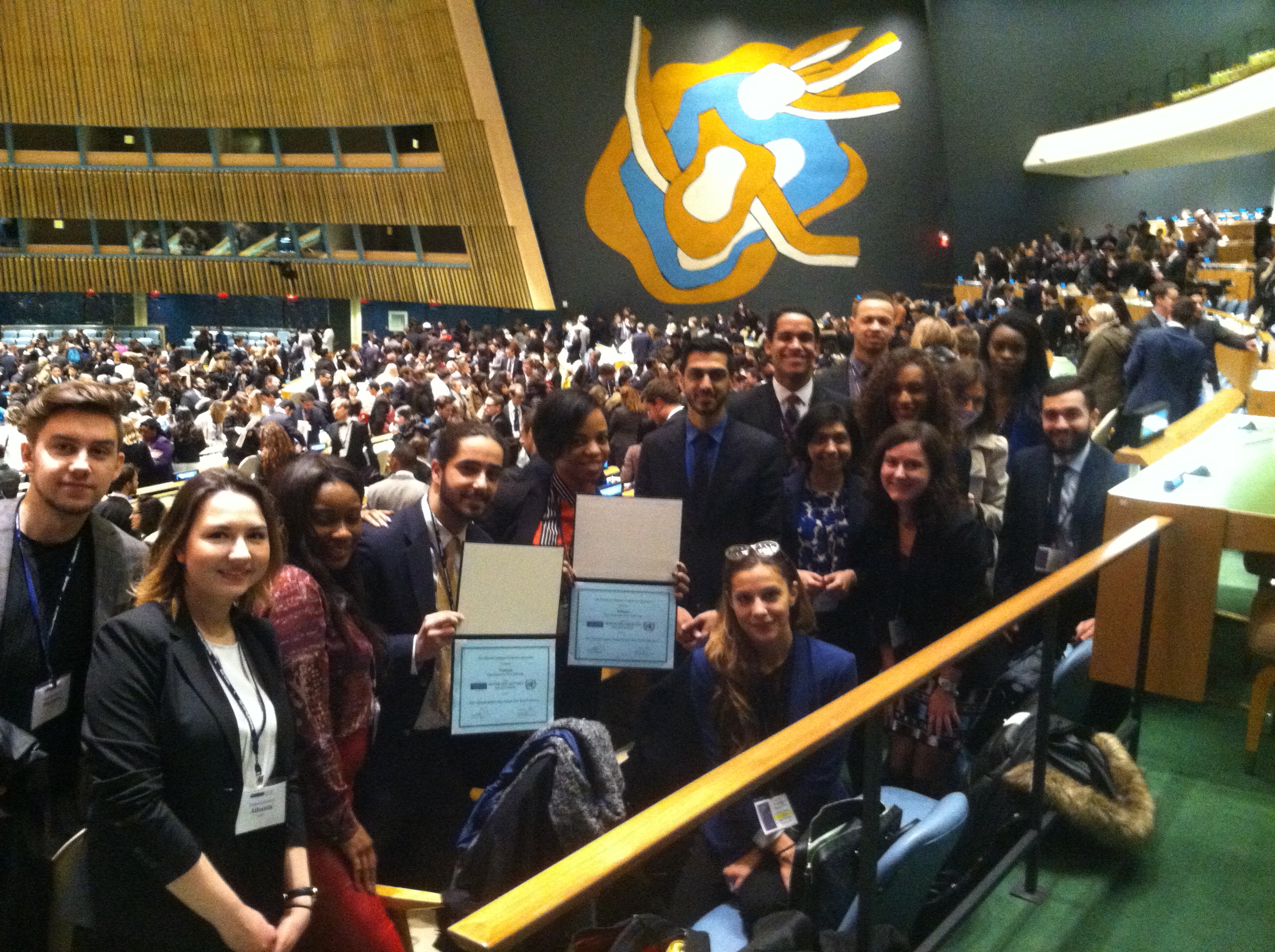 The Pace NYC Model United Nations students in the UN General Assembly Room after the Closing Ceremony of the 2015 National Model UN conference in New York City.