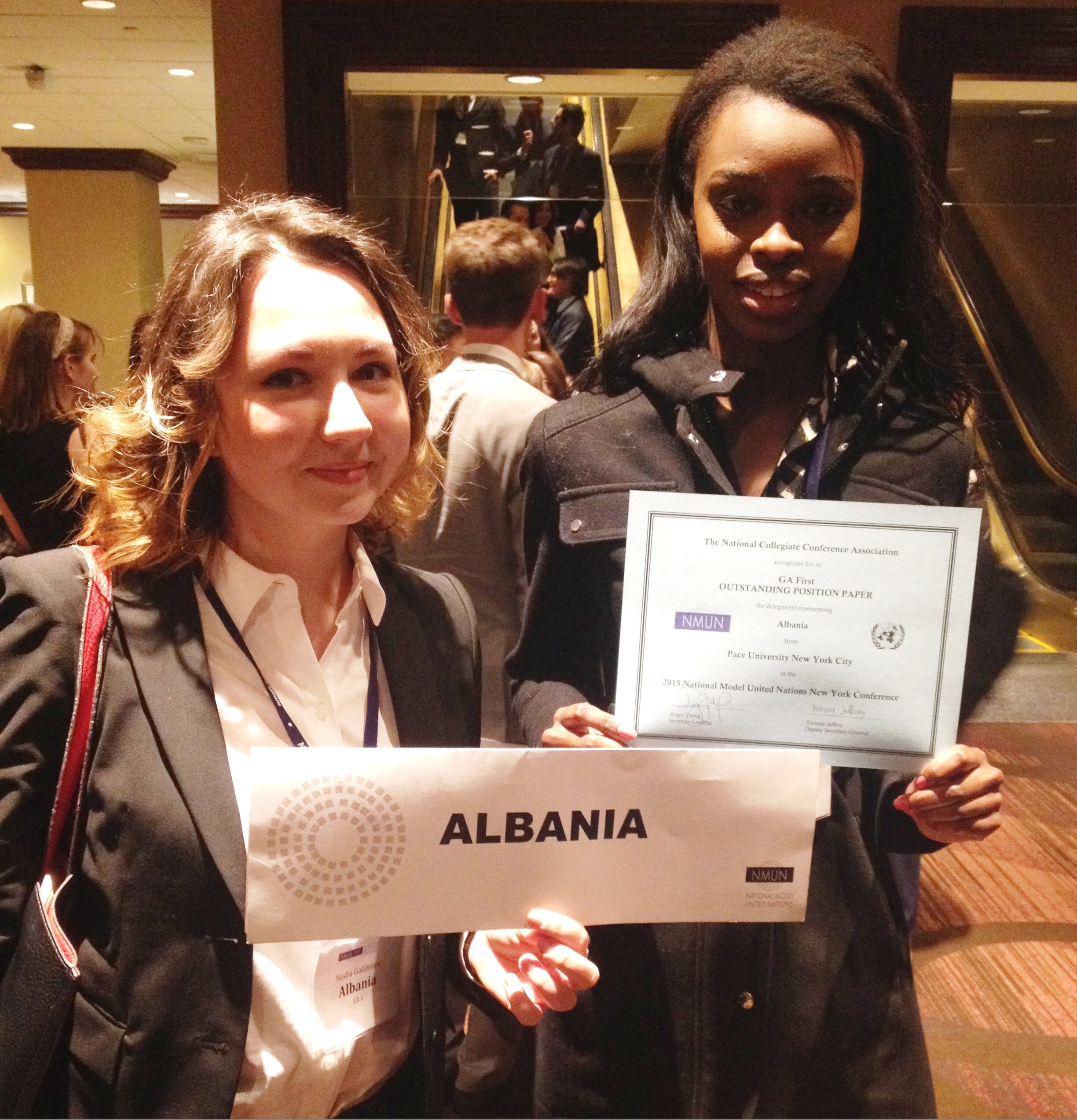 Pace students Latrelle Gray Jones-Booker and Syuyumbika Galimova display their Outstanding Position Paper award at the 2015 National Model United Nations conference in New York City.