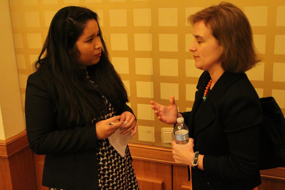 Pace University New York City student Ingrid Soto Tornero talks with a guest speaker from the US State Department at the 2015 National Model UN conference in Washington DC.